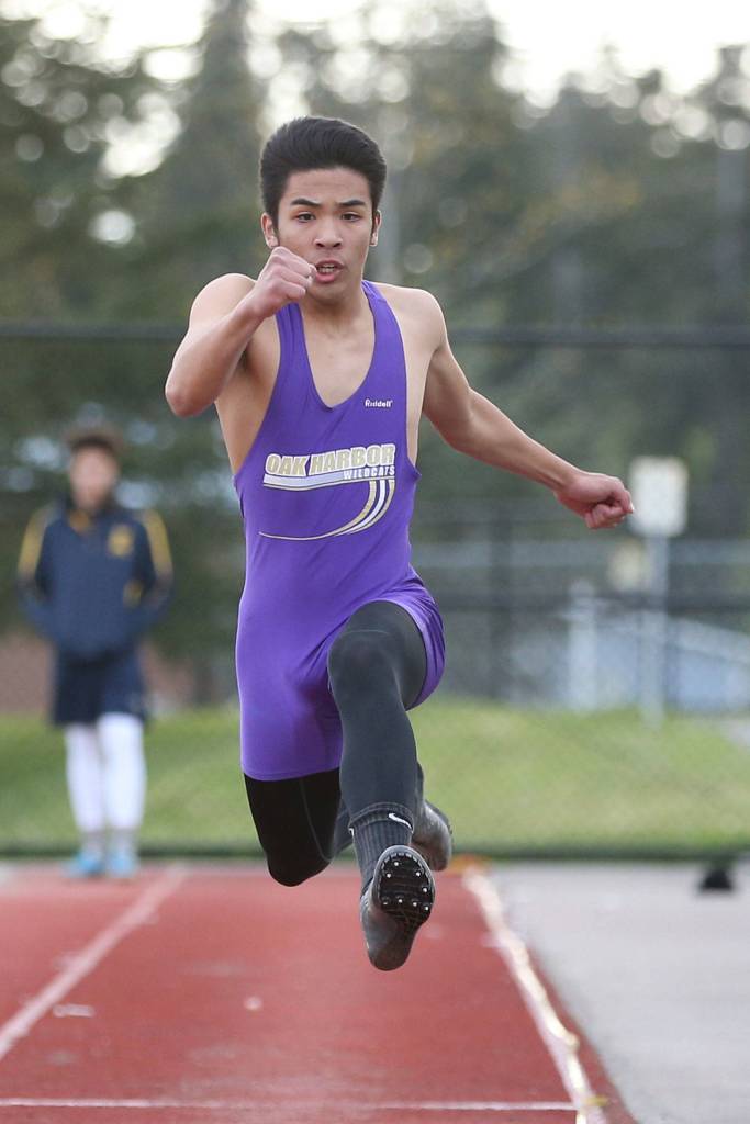 Garren Guerrero leaps to second place in the triple jump. The senior placed in four events in the meet. (Photo by John Fisken)