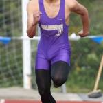 Garren Guerrero heads down the runway on the way to winning the triple jump. (Photo by John Fisken)