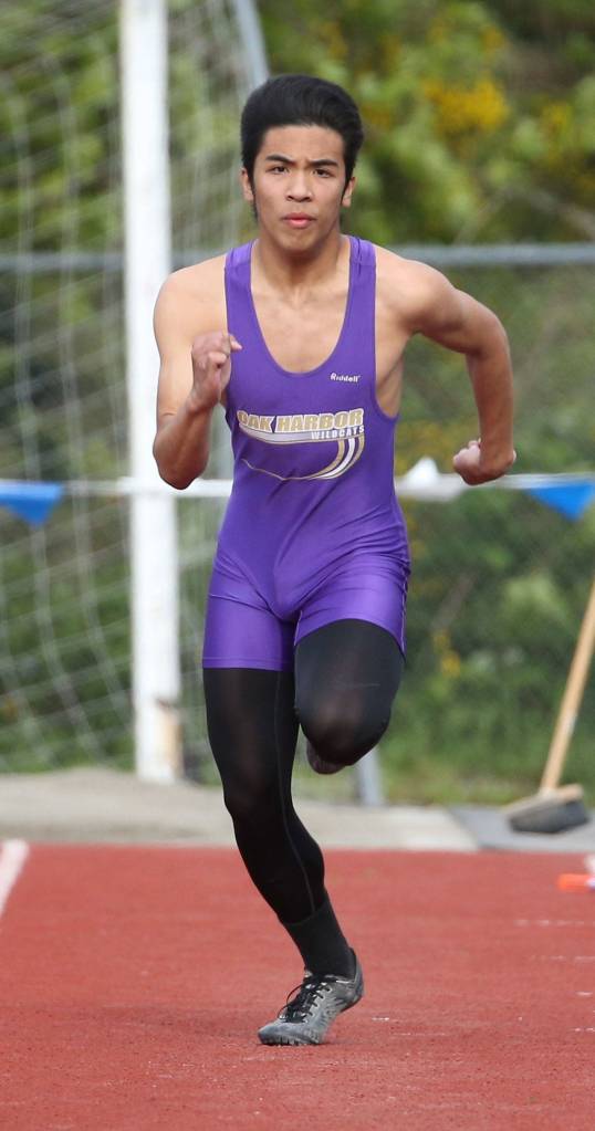 Garren Guerrero heads down the runway on the way to winning the triple jump. (Photo by John Fisken)