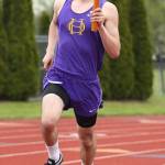Miguel Guzman takes part in the 4x800 relay. (Photo by John Fisken)