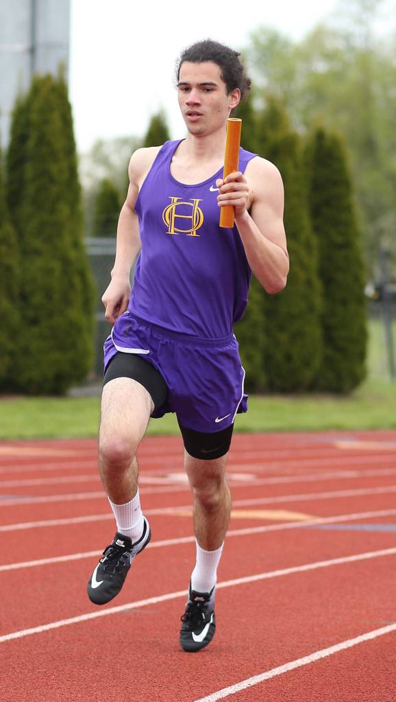 Miguel Guzman takes part in the 4x800 relay. (Photo by John Fisken)