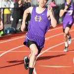 Miguel Guzman rounds the turn in the 400 finals. Guzman placed third and Ozell Jackson, right, took fifth. (Photo by John Fisken)