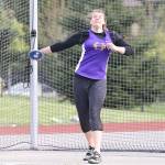 Julie Jansen throws a PR of 115-04 to win the discus for the Wildcats. (Photo by John Fisken)