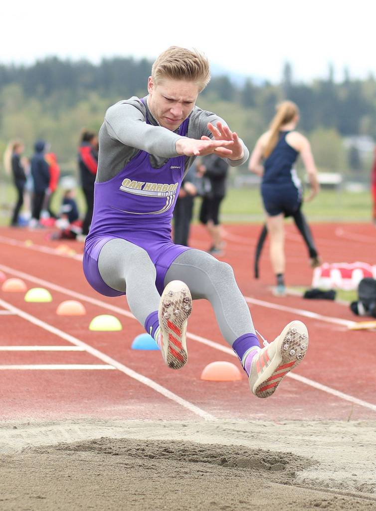 Long jumper Andrew Miller picks up one of five wins by Oak Harbor Saturday. (Photo by John Fisken)