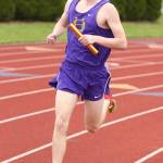 Wyatt Pauley runs a leg in th3 4x800 relay. (Photo by John Fisken)