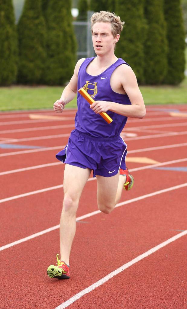 Wyatt Pauley runs a leg in th3 4x800 relay. (Photo by John Fisken)