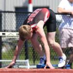 Jacob Smith gets ready to start his school-record 200-meter run. (Photo by John Fisken)