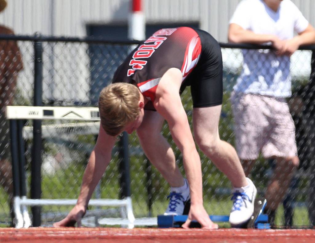 Jacob Smith gets ready to start his school-record 200-meter run. (Photo by John Fisken)