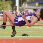 Kristina Tirado clear the bar in the high jump Friday. (Photo by John Fisken)