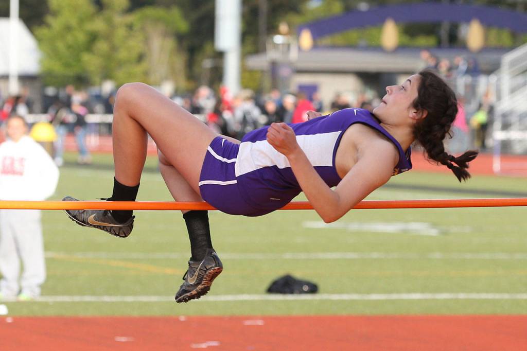 Kristina Tirado clear the bar in the high jump Friday. (Photo by John Fisken)