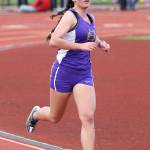 Senior Carolynn Wicker runs in the 1,600-meter final at Wednesday&rsquo;s divisional championships. (Photo by John Fisken)