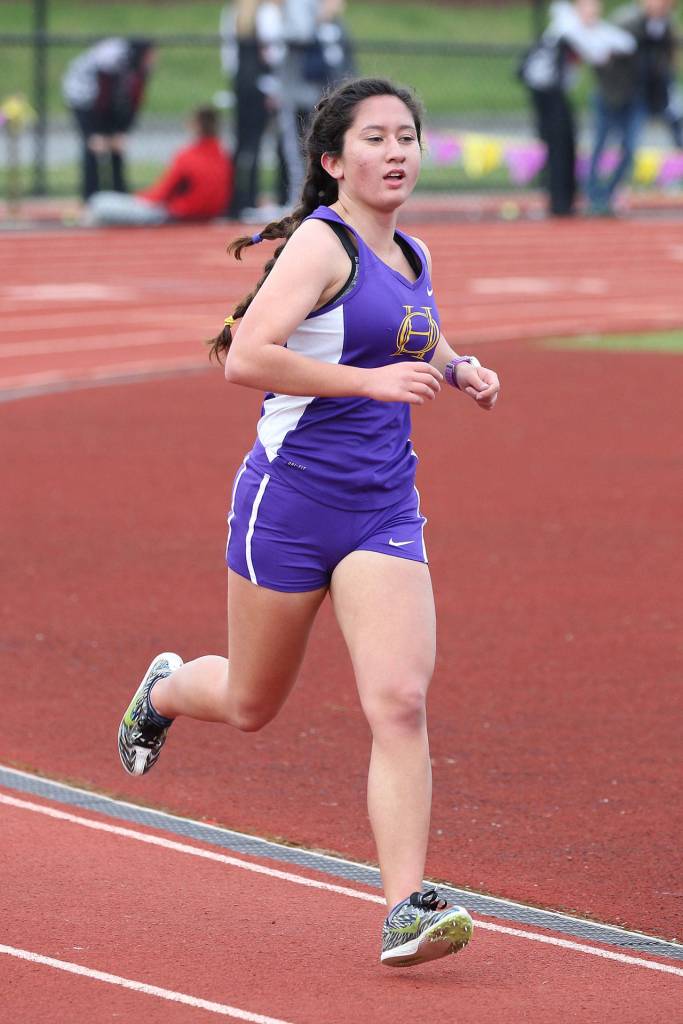 Senior Carolynn Wicker runs in the 1,600-meter final at Wednesday&rsquo;s divisional championships. (Photo by John Fisken)