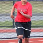 Tiana Jackson runs to second place in the 200 meters. (Photo by John Fisken)
