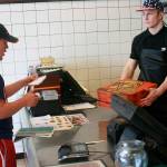 Transition student Lucas Etzell picks up Little Caesars as part of his pizza delivery business that he started at school. Photo by Daniel Warn/Whidbey News-Times