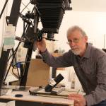John Olsen specializes in black and white photography using classic large-format cameras. He develops and prints film in his dark room at his Coupeville home.                                Photo by Patricia Guthrie/Whidbey News-Times