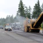 Road crews will be out all summer repaving more than 30 miles of Highway 525/State Highway 20 from Coupeville to Clinton. Drivers should allow an extra 30 minutes for their trips and to catch ferries. Crews worked near the intersection of Classic Road and HIghway 525 Tuesday morning putting down new asphalt. Photo by Patricia Guthrie/Whidbey News-Times
