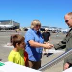At Saturday&rsquo;s NAS Whidbey Island Open House, a long line formed to get a peek inside the Navy&rsquo;s brand new jet, Poseidon P-BA, just delivered from Boeing. Greeting visitors at the Poseidon entrance is Cmdr. Bryan Hager.                                Photo by Patricia Guthrie/Whidbey News-Times