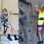 As Jared Bryant, 14, (left) comes down, Carliee Meadows, 11, concentrates on going up a route on the 35-feet-high rock wall challenge. The activity was one of many at Saturday&rsquo;s NAS Whidbey Island Open House. By Patricia Guthrie/Whidbey News-Times