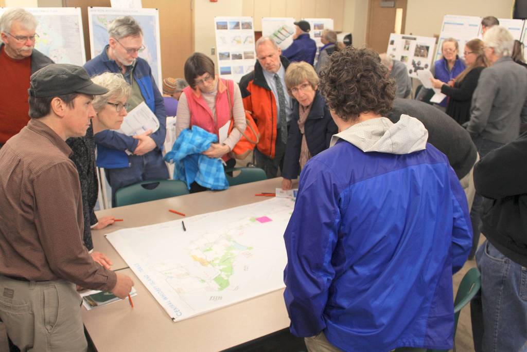 Residents look over maps for possible additions to hiking, biking and beach areas on Whidbey Island during public meetings this winter. A second round of meetings take place in June on the non-motorized trail plan. Photo by Patricia Guthrie/Whidbey News-Times