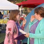 Dawnelle Conlisk shares a snack and some laughs with her daughter Mary at the The Relay for Life of Whidbey Island event Friday, June 2, 2017, at North Whidbey Middle School in Oak Harbor. Conlisk has been dealing with cancer for 22 years. Photo by Ron Newberry/Whidbey News-Times