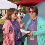 Dawnelle Conlisk shares a snack and some laughs with her daughter Mary at the The Relay for Life of Whidbey Island event Friday, June 2, 2017, at North Whidbey Middle School in Oak Harbor. Conlisk has been dealing with cancer for 22 years. Photo by Ron Newberry/Whidbey News-Times