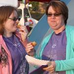 Dawnelle Conlisk shares a snack and some laughs with her daughter Mary at the The Relay for Life of Whidbey Island event Friday, June 2, 2017, at North Whidbey Middle School in Oak Harbor. Conlisk has been dealing with cancer for 22 years. Photo by Ron Newberry/Whidbey News-Times