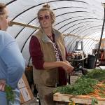 Photos by Ron Newberry/Whidbey News-Times                                Coupeville farmer Georgie Smith, left, speaks with Willowood harvest manager Alanah Lawrason last week while she rinsed off Mokum carrots in the farm&rsquo;s newly constructed packing shed. Nearly three months after a fire destroyed a historic barn on her property, Smith has watched a steady recovery and is overwhelmed by generosity from the community.
