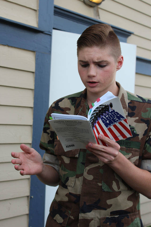 Carl Davis goes over his lines for the play, &ldquo;A Few Good Men,&rdquo; outside Whidbey Playhouse Community Theater prior to Monday night rehearsal. The military courtroom drama will be shown free to active and retired military at 7:30 p.m. Thursday. The play runs through June 25. Photo by Patricia Guthrie/Whidbey News-Times