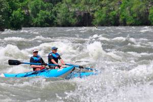 Father, son save teenager in rafting trip