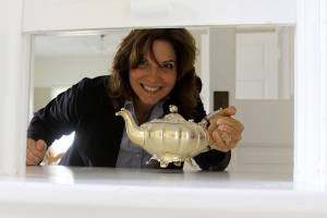 Robyn Myers, conference services manager at the Camp Casey Conference Center and Fort Casey Inn, has some fun while providing a tour of the iconic Colonel&rsquo;s House Wednesday, June 7, 2017. The house and other attractions at the former Fort Casey will be open for the public to view during an open house from noon-4 p.m. Friday, June 16. Photo by Ron Newberry/Whidbey News-Times