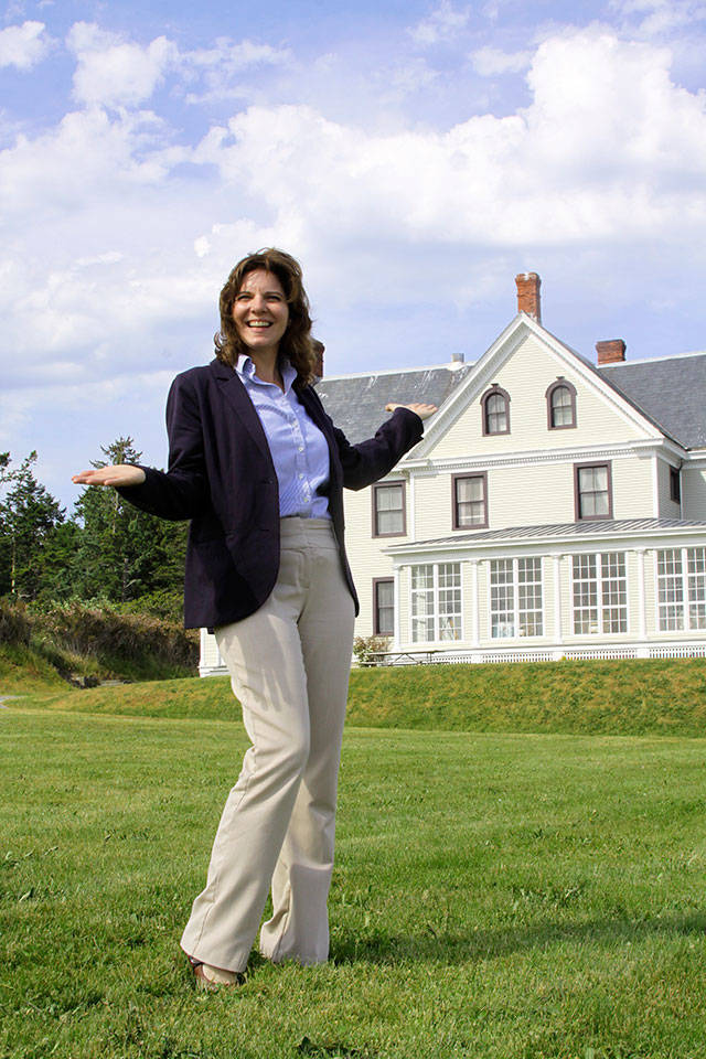 Robyn Myers, conference services manager at the Camp Casey Conference Center and Fort Casey Inn, has some fun while providing a tour of the iconic Colonel&rsquo;s House Wednesday, June 7, 2017. The house and other attractions at the former Fort Casey will be open for the public to view during an open house from noon-4 p.m. Friday, June 16. Photo by Ron Newberry/Whidbey News-Times