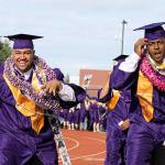 Oak Harbor High School seniors Princeton Lollar, left, and John Purcell dance along the processional toward their seats in the 2017 commencement ceremony Monday. Photo by Daniel Warn/Whidbey News-Times