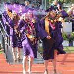 With diplomas in hand, a group of the newest Oak Harbor High School graduates celebrate with glitter at Monday&rsquo;s commencement ceremony. Photo by Daniel Warn/Whidbey News-Times