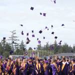 The Oak Harbor High School class of 2017 toss their caps in a surge of celebration as the commencement ceremony at Wildcat memorial Stadium come to a close Monday. Photo by Daniel Warn/Whidbey News-Times