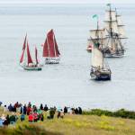 A spectacular view of the Tuesday&rsquo;s Parade of Sail from Fort Casey State Park, where hundreds of people viewed the grand fleet of tall ships from high bluffs and the beach. Photo by John Fisken