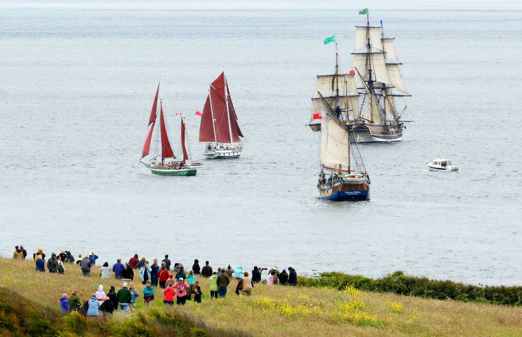 A spectacular view of the Tuesday&rsquo;s Parade of Sail from Fort Casey State Park, where hundreds of people viewed the grand fleet of tall ships from high bluffs and the beach. Photo by John Fisken