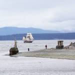 Tall ships during the Parade of Sail pass through Admiralty Inlet Tuesday drawing a large crowd from the beaches on the west side of Whidbey Island. Photo by Ron Newberry/Whidbey News-Times