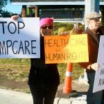 Oak Harbor resident Jane Janehning, left, and Clinton resident Malcolm Cummings protest the coming of Trumpcare as part of a protest vigil Tuesday in Coupeville. Photo by Daniel Warn/Whidbey News-Times