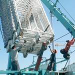 Workers from Davis Amusement Cascadia set up a ride Thursday at Windjammer Park in preparation for the Fourth of July Carnival. Photo by Daniel Warn/Whidbey News-Times