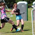 Gracie Hiteshew, right, get ready to score. (Photo by Trina Coe)