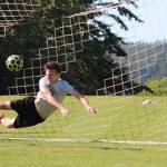 Kegan Snell makes a diving stop. (Photo by Trina Coe)