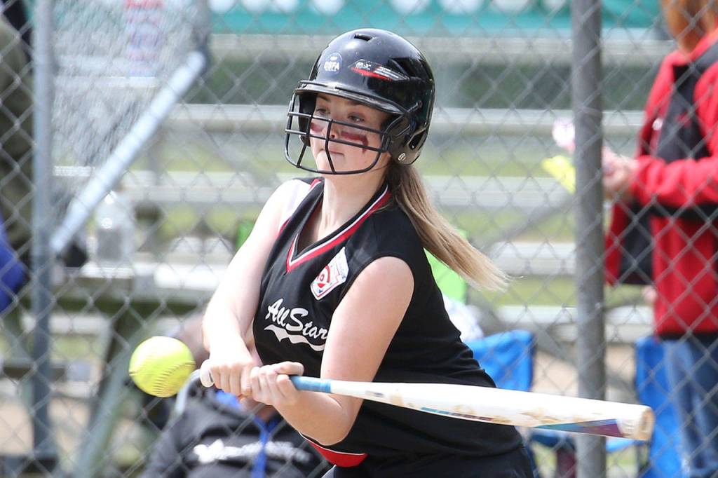 Kylie Vanvelkinburg attacks a pitch in the sweep of Orcas Island Saturday. (Photo by John Fisken)