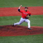 Ben Eztell fires a pitch for St. John&rsquo;s College. The junior from Coupeville earned all-league honors this spring. (Photo by Alexis Jungles)