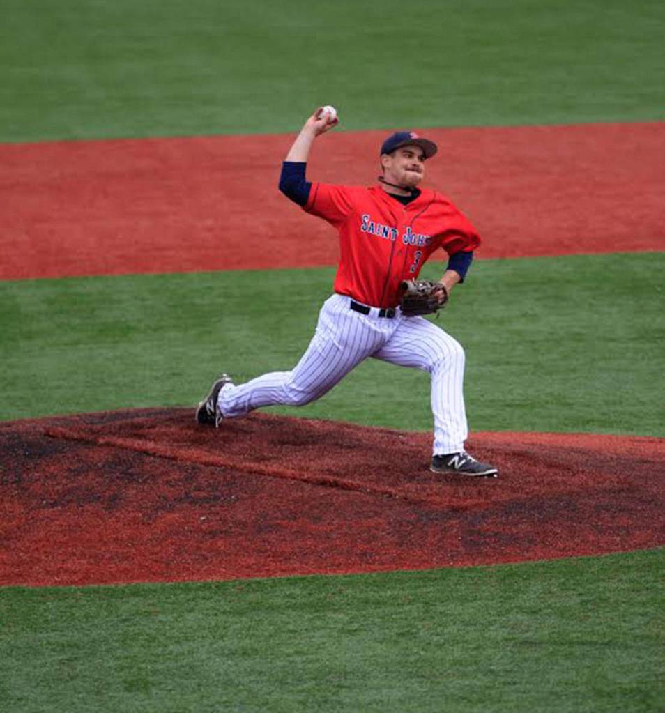 Ben Eztell fires a pitch for St. John&rsquo;s College. The junior from Coupeville earned all-league honors this spring. (Photo by Alexis Jungles)