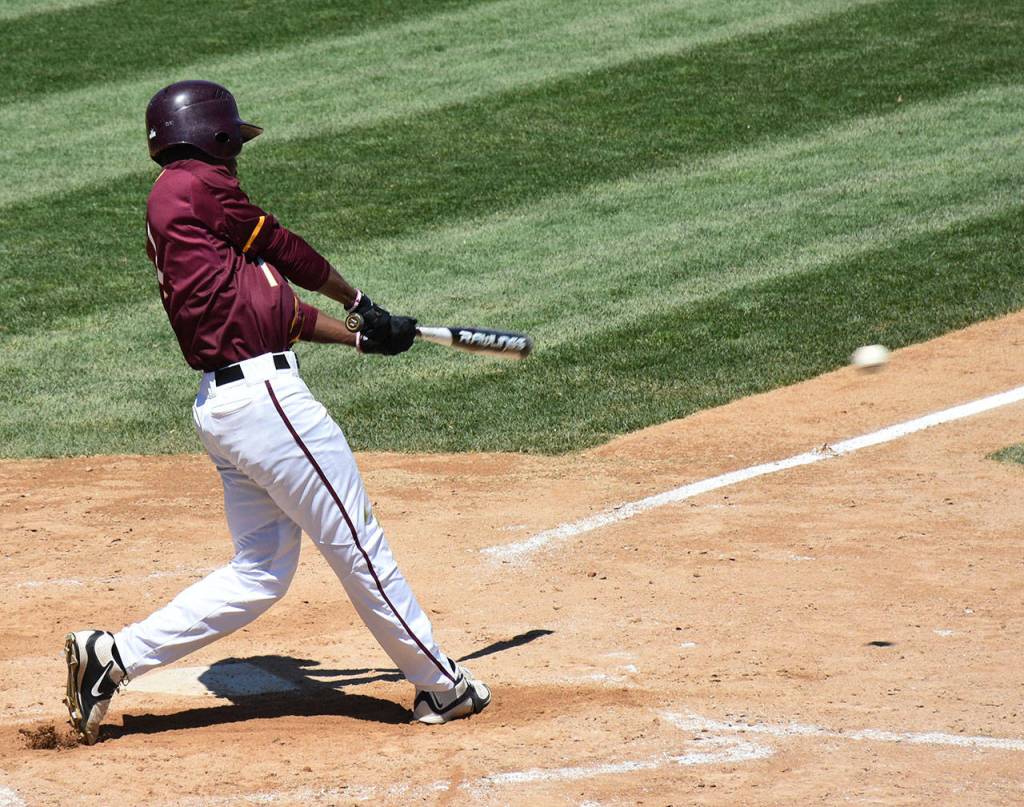 Anthony Stewart rips a hit for Minnesota Crookston. (Photo by Shawn Smith)