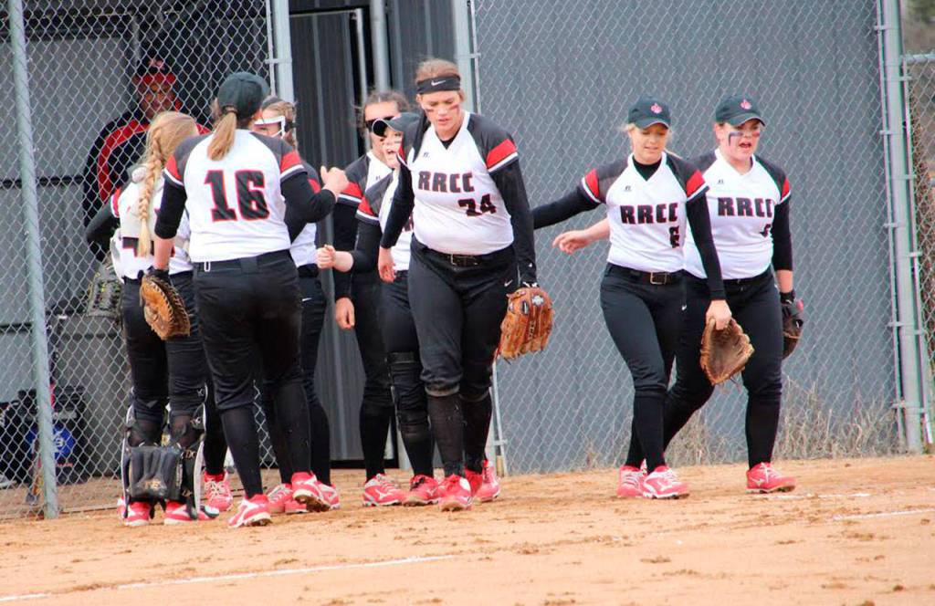 Monica Vidoni (24) takes the field with her Rainy River Community College teammates. (Photo by Barb Fisher)