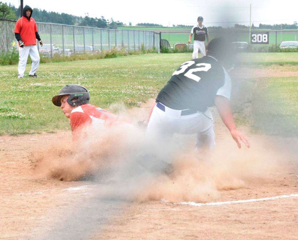Gavin Knoblich scores Coupeville&rsquo;s first run on a wild pitch. (Photo by Karen Carlson)