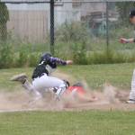 Gavin Knoblich dives safely into third base after escaping a rundown.(Photo by Jim Waller/Whidbey News-Times)