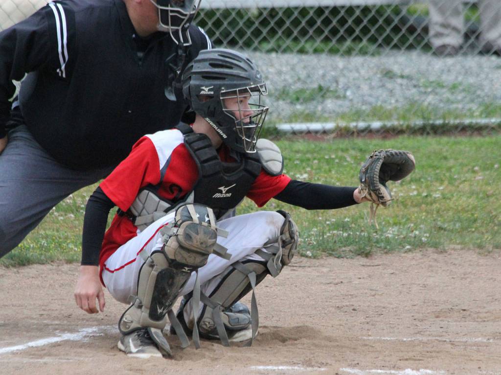 Catcher Caleb Meyer sets up to receive a pitch.(Photo by Jim Waller/Whidbey News-Times)