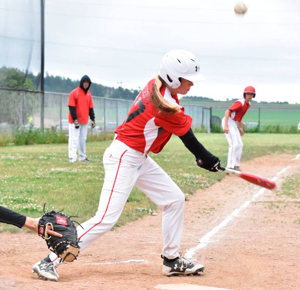 Chelsea Prescott fouls off a pitch. (Photo by Karen Carlson)
